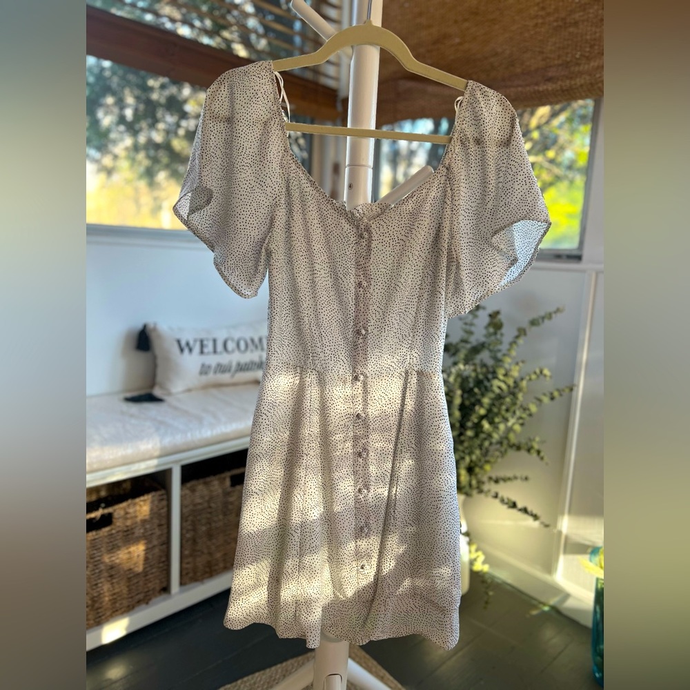 White, polka-dotted summer dress.